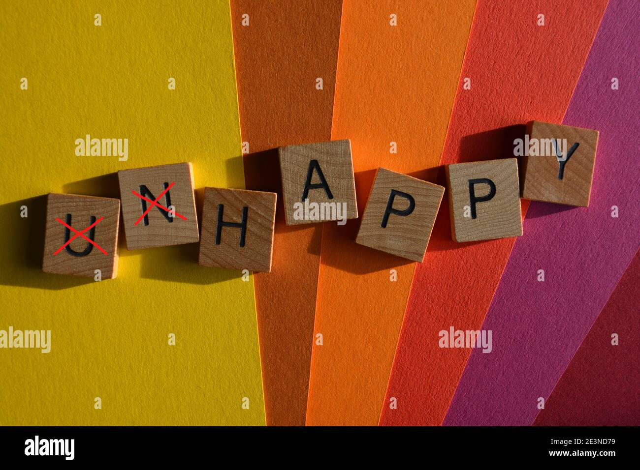 Unhappy, word with prefix Un crossed out leaving word with opposite