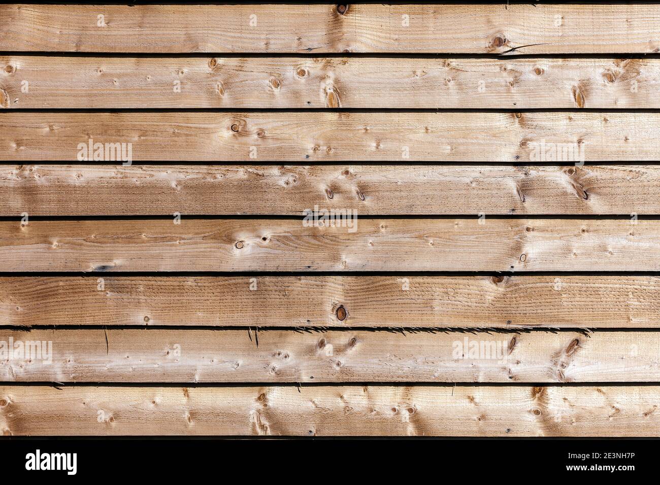 New modern brown wooden fence panel background with rough knotted grain timber texture, stock photo image Stock Photo