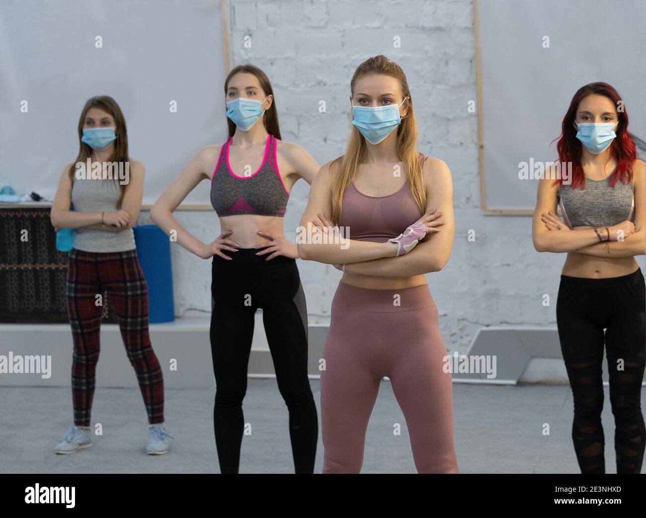 yoga during pandemic wearing medical face protective mask athletic
