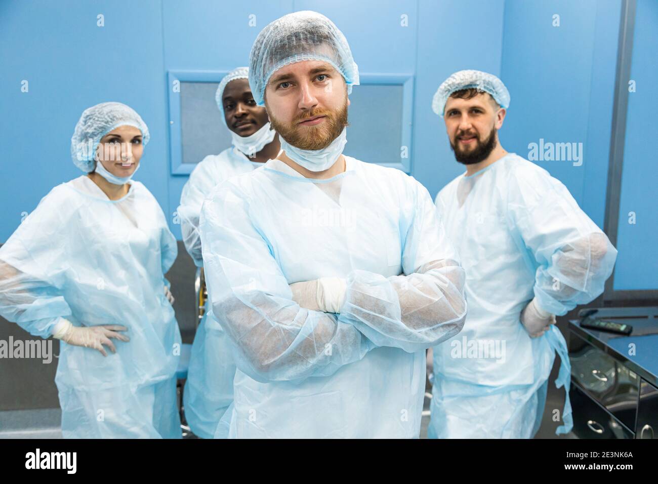 Doctors In Uniform Portrait of a team of doctors in uniform and medical masks after ...