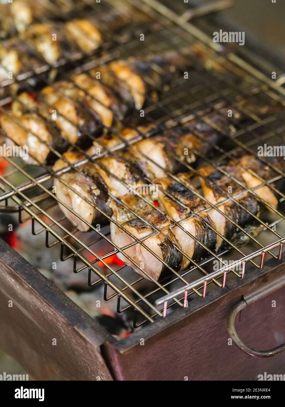 Fried trout fish on charcoal grill. Roasted fish pieces on fire Stock Photo Alamy
