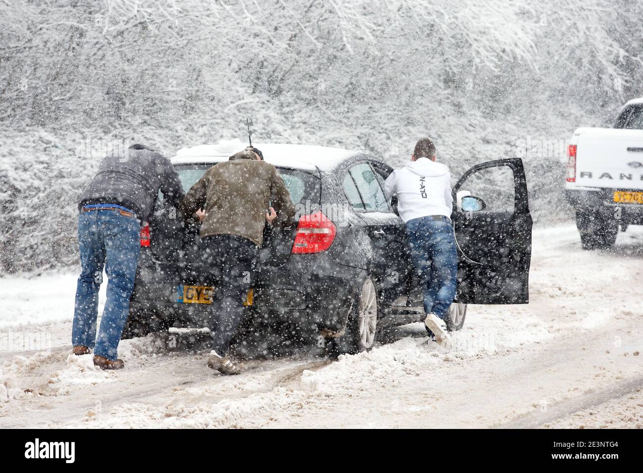 Cars struggle to get up a hill in the snow Barnsley, South Yorkshire