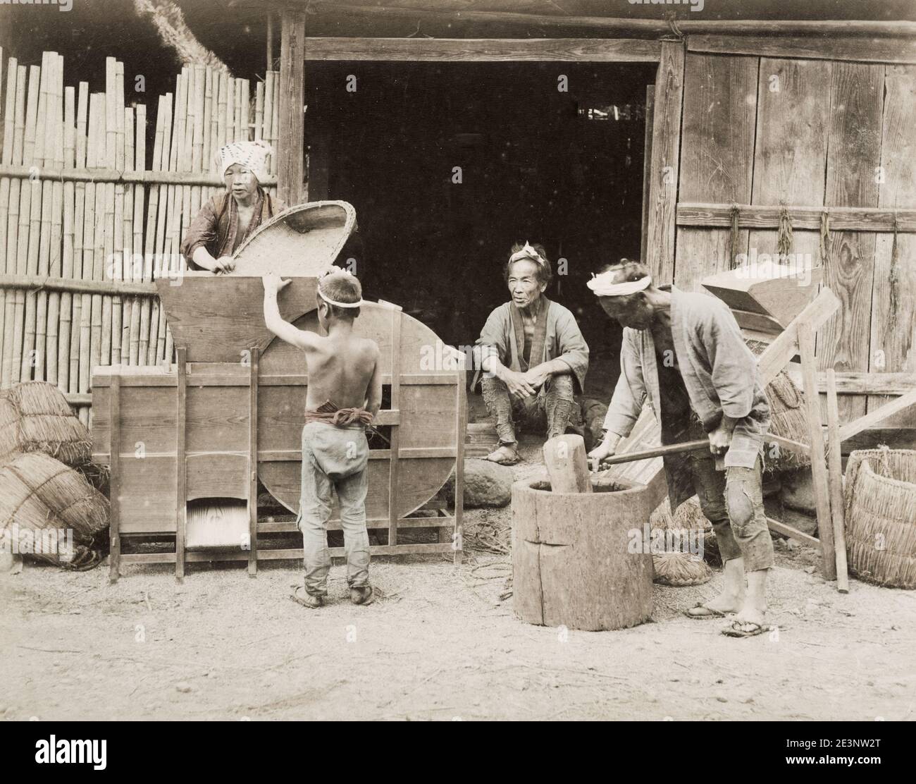 Vintage 19th century photograph: farming, agriculture, food processing, pounding rice - the last cleaning using fans, Japan. Stock Photo