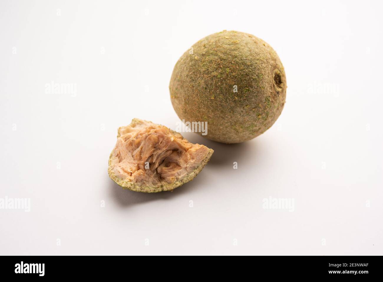 Wood apple or Kavath fruit, isolated over white background Stock Photo