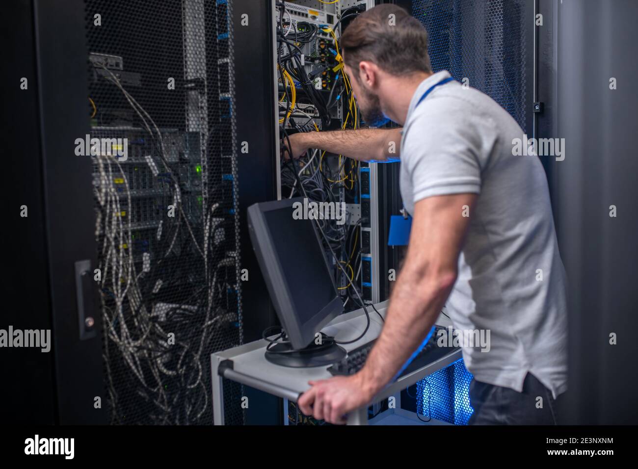 Busy man near counter supervising server Stock Photo - Alamy