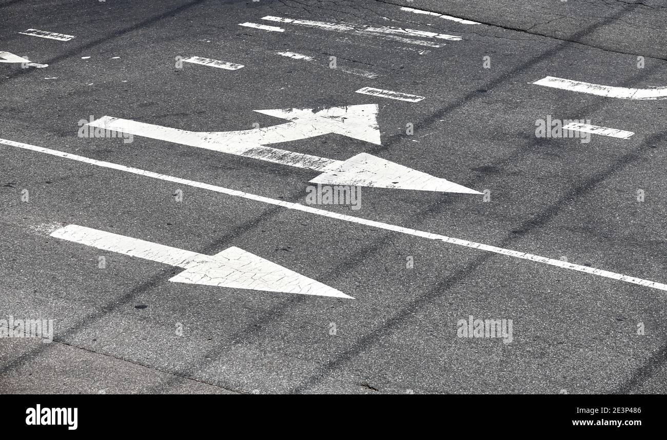 Road surface arrow markings on asphalt in New York City, USA. Stock Photo
