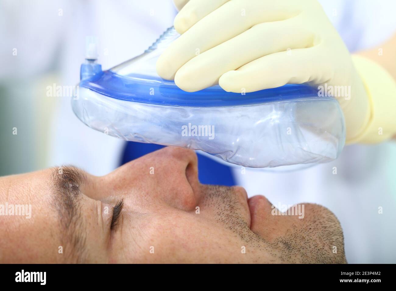 Anesthesiologist gives a respiratory anesthesia to a patient before