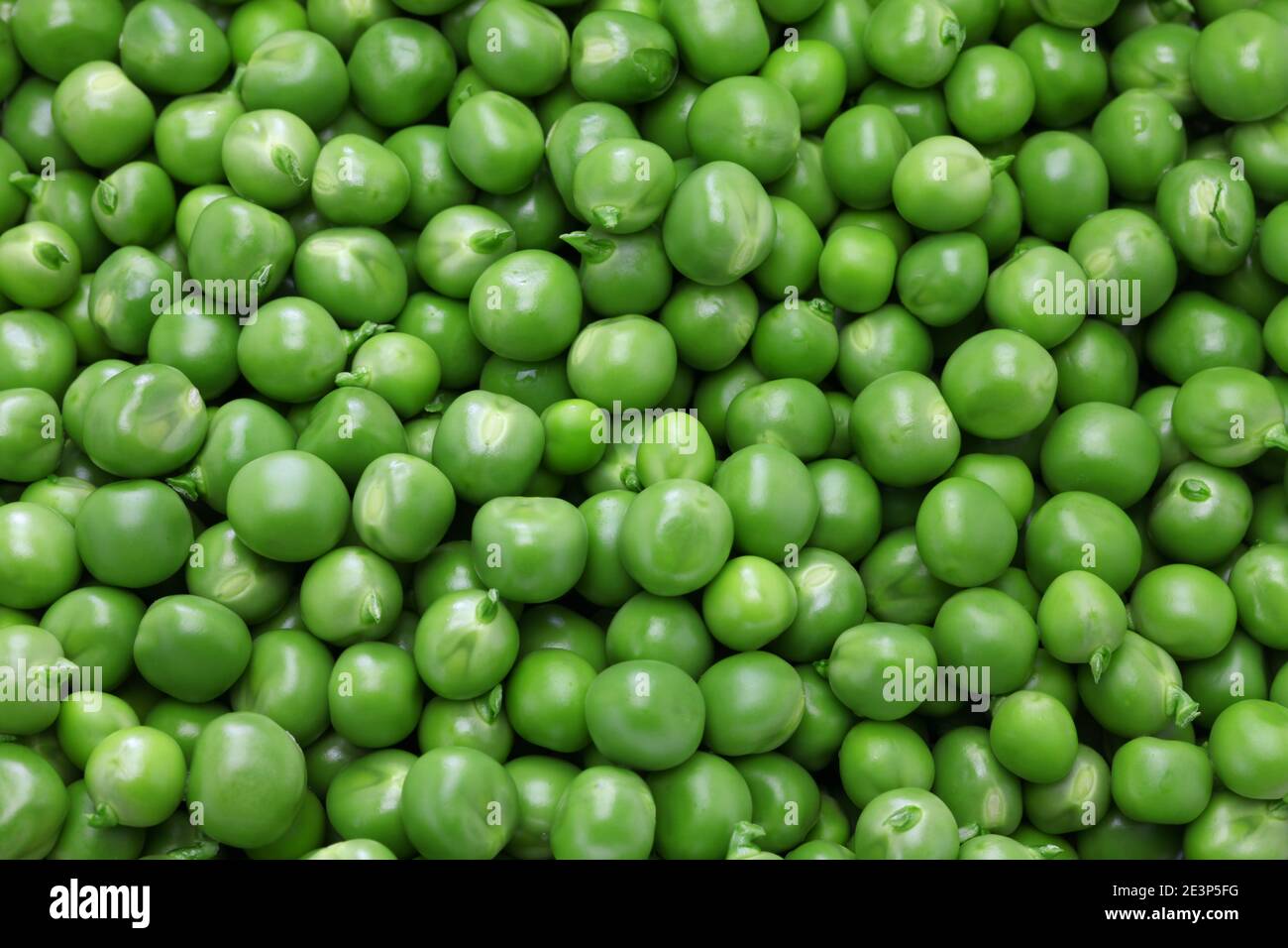 fresh organic green peas background Stock Photo