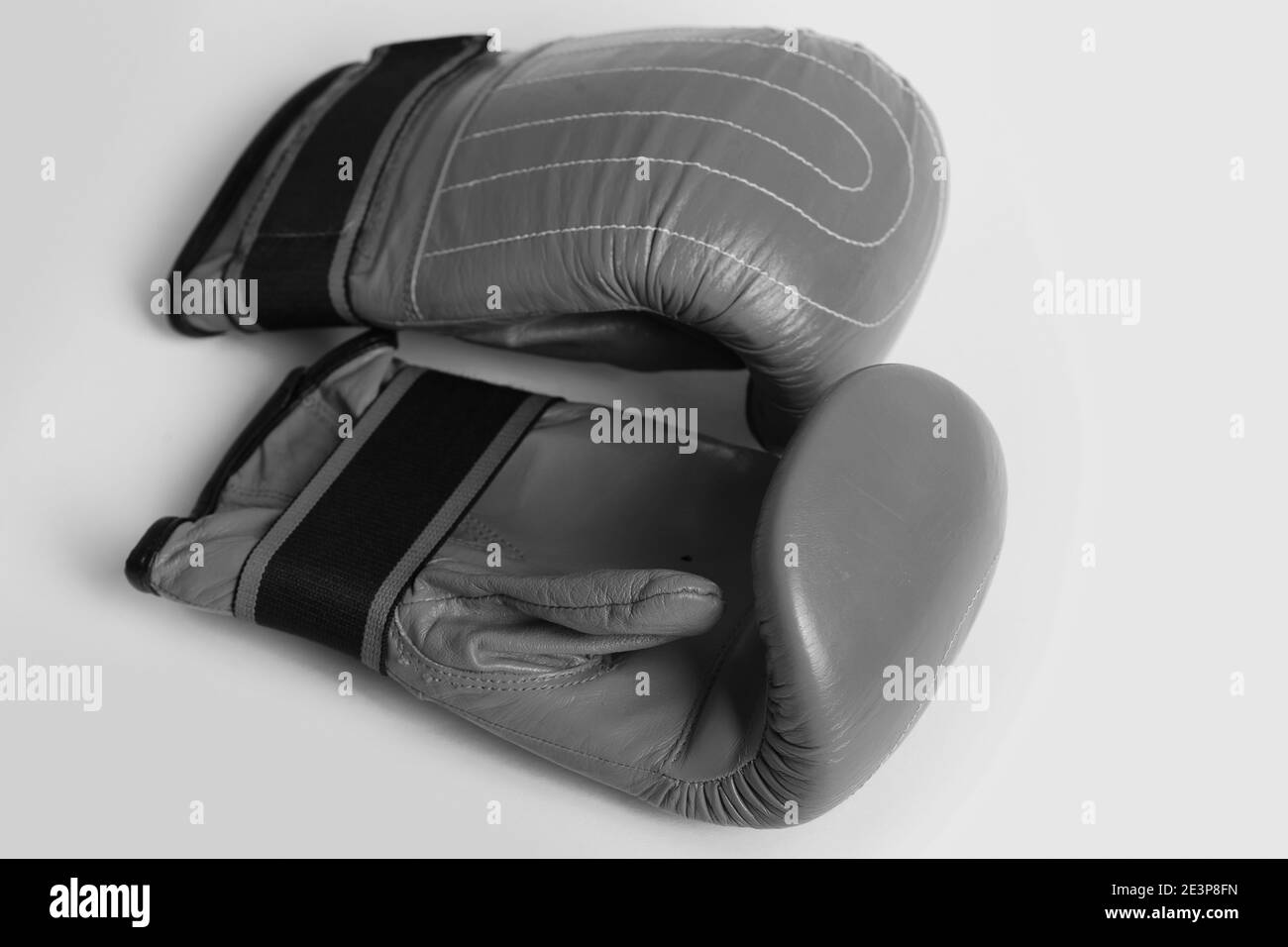 Strong sports equipment concept with juicy red boxing gloves isolated on yellow background, top view Stock Photo