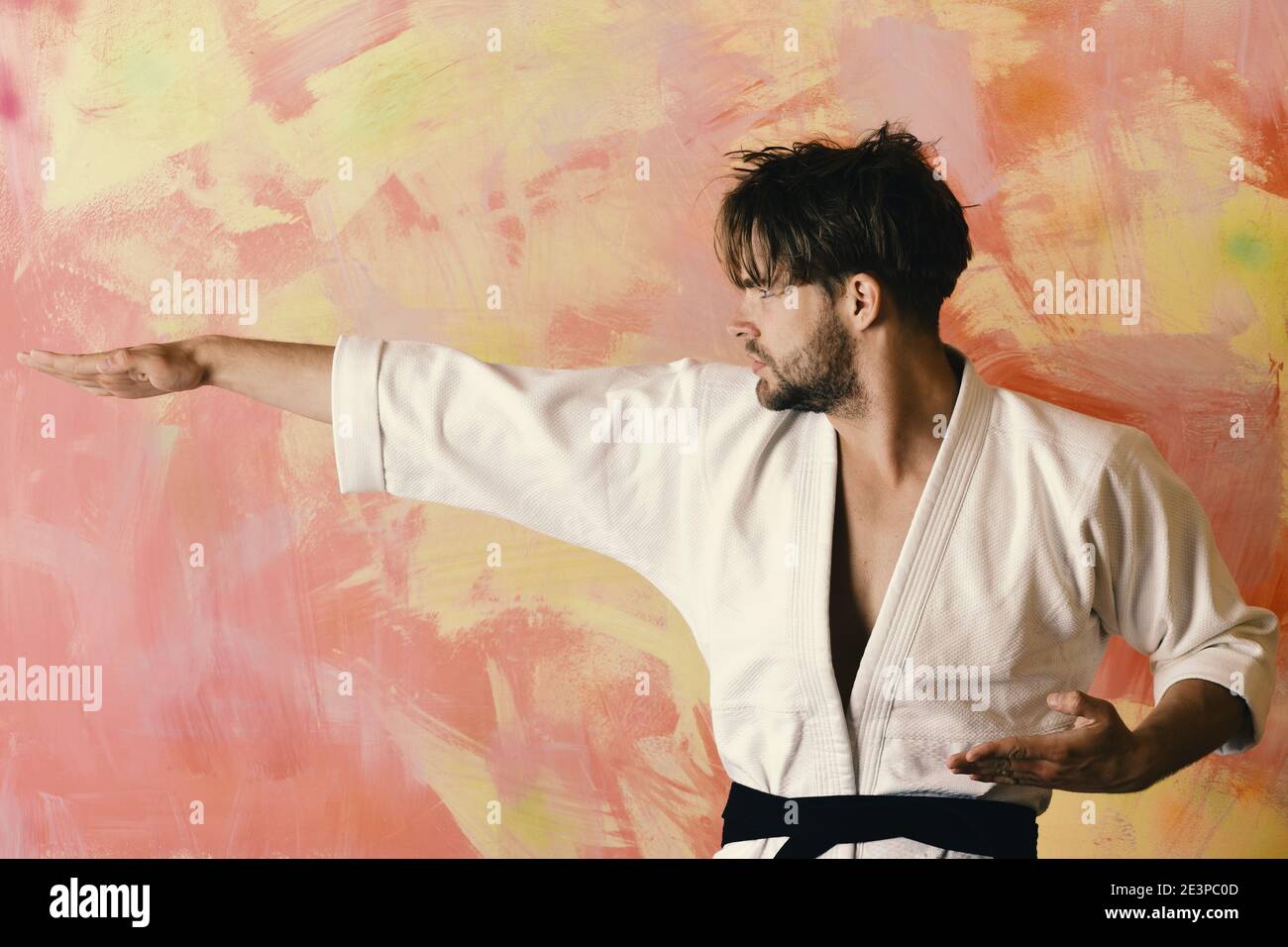 A Man, In A Black Kimono Is Practicing Martial Arts Technique With A Long  Bamboo Fighting Stick. Stock Photo, Picture and Royalty Free Image. Image  91980191.