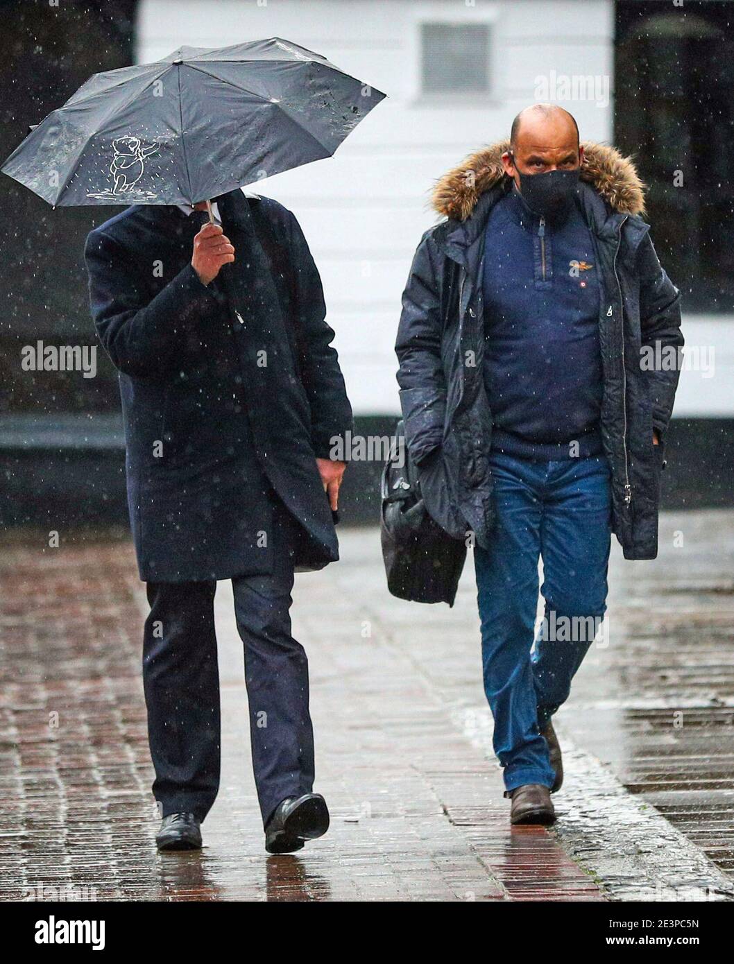 Philip Smith (right), 58, a company manager of Wood Flour Mill in Bosley arrives at Chester Town Hall to stand trial on health and safety charges, along with colleagues, after the death of four employees in an explosion at the mill on July 17 2015. Mill owner George Boden is charged with four counts of gross negligence manslaughter. Picture date: Wednesday January 20, 2021. Stock Photo