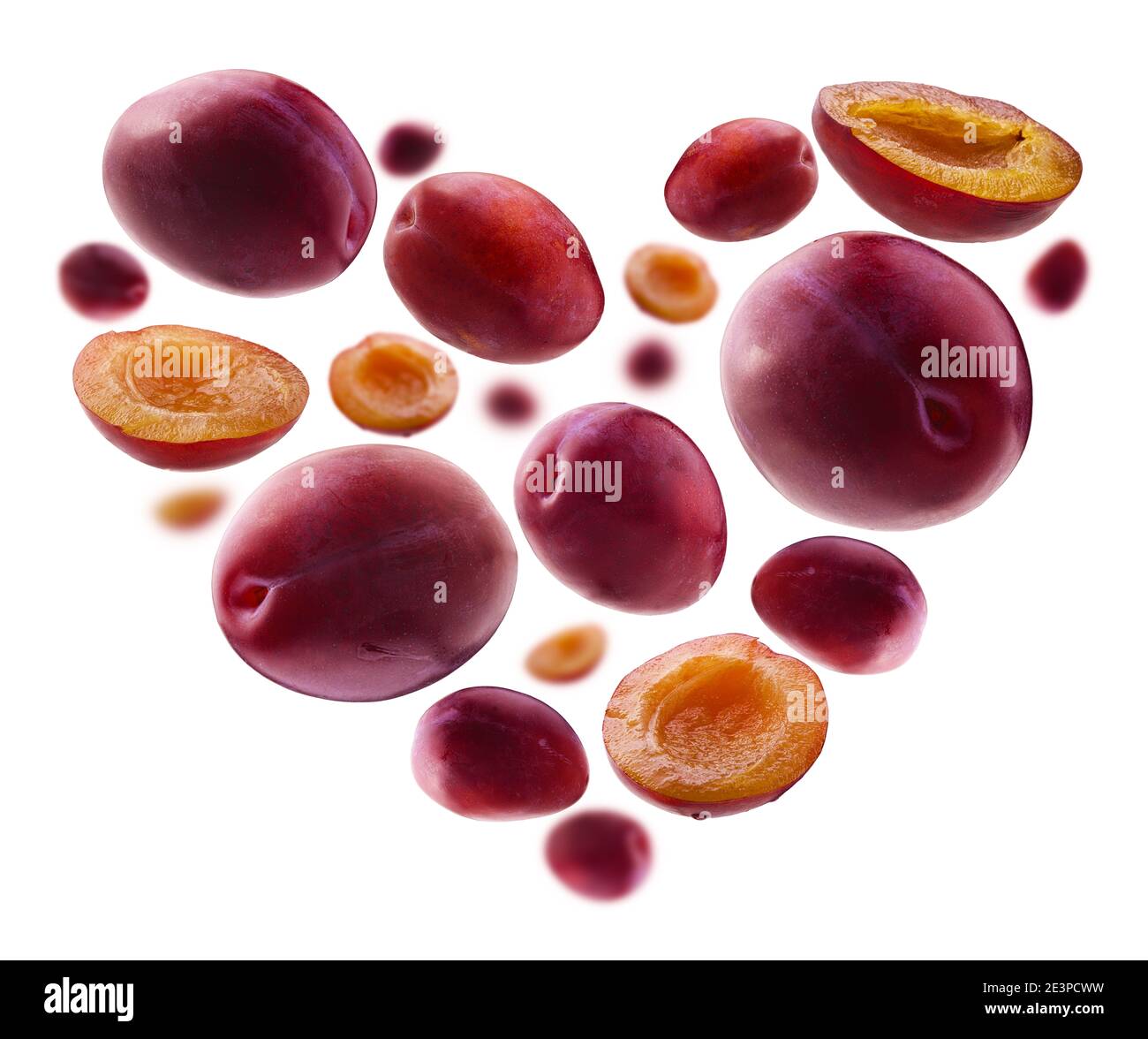 Heart shaped red plums on white background Stock Photo Alamy
