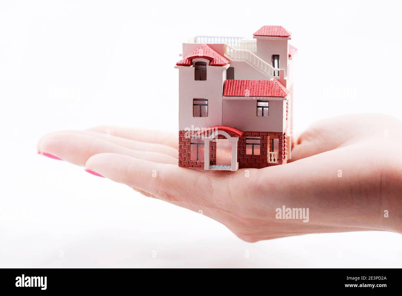 Hands holding a model of house high quality photo Stock Photo - Alamy