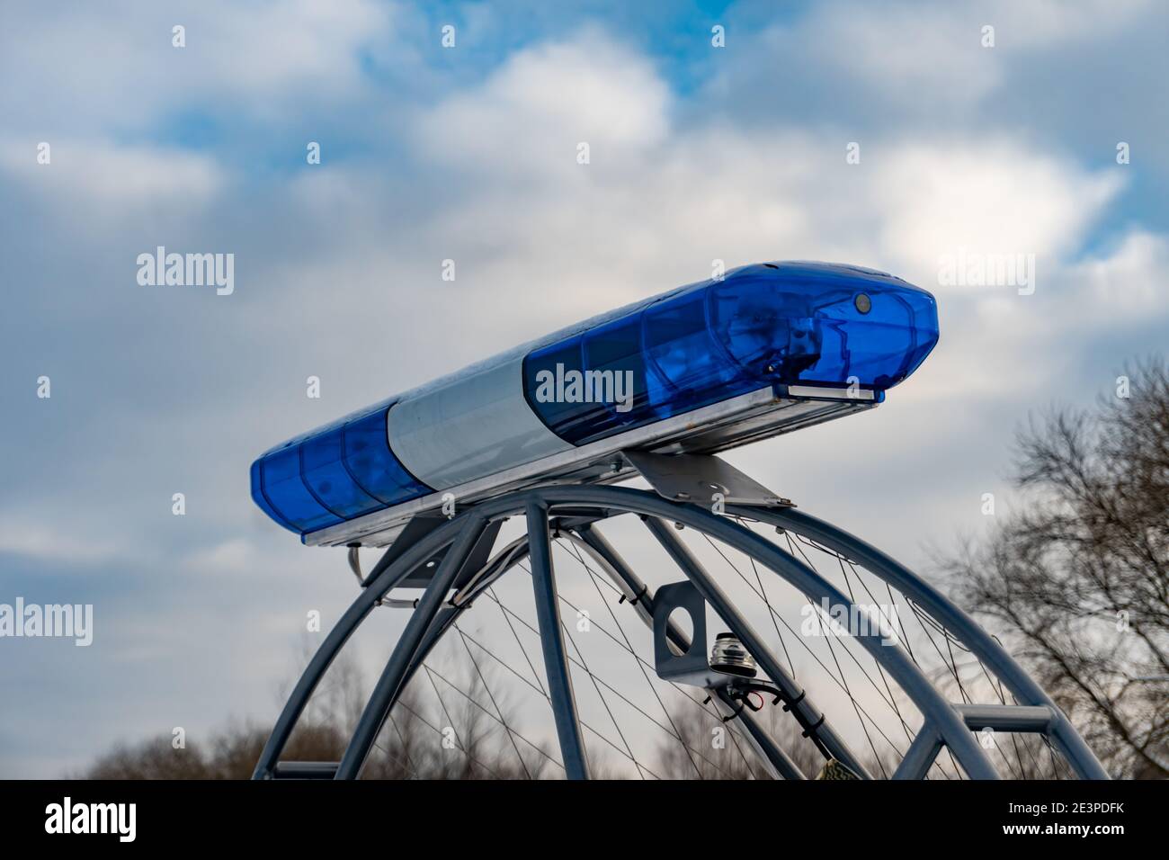 Police flashers on a snowmobile close up, police all-terrain vehicle in winter, air-cushion boat Stock Photo