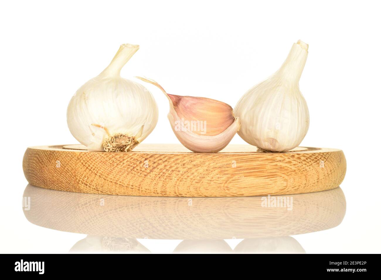 One clove of garlic and two whole heads of spicy juicy flavorful garlic