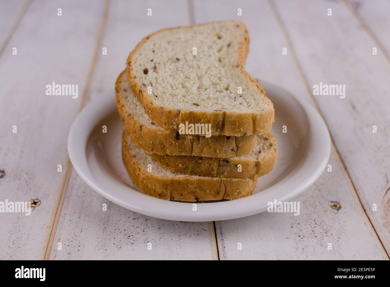a sliced bread on a wooden a table Stock Photo - Alamy