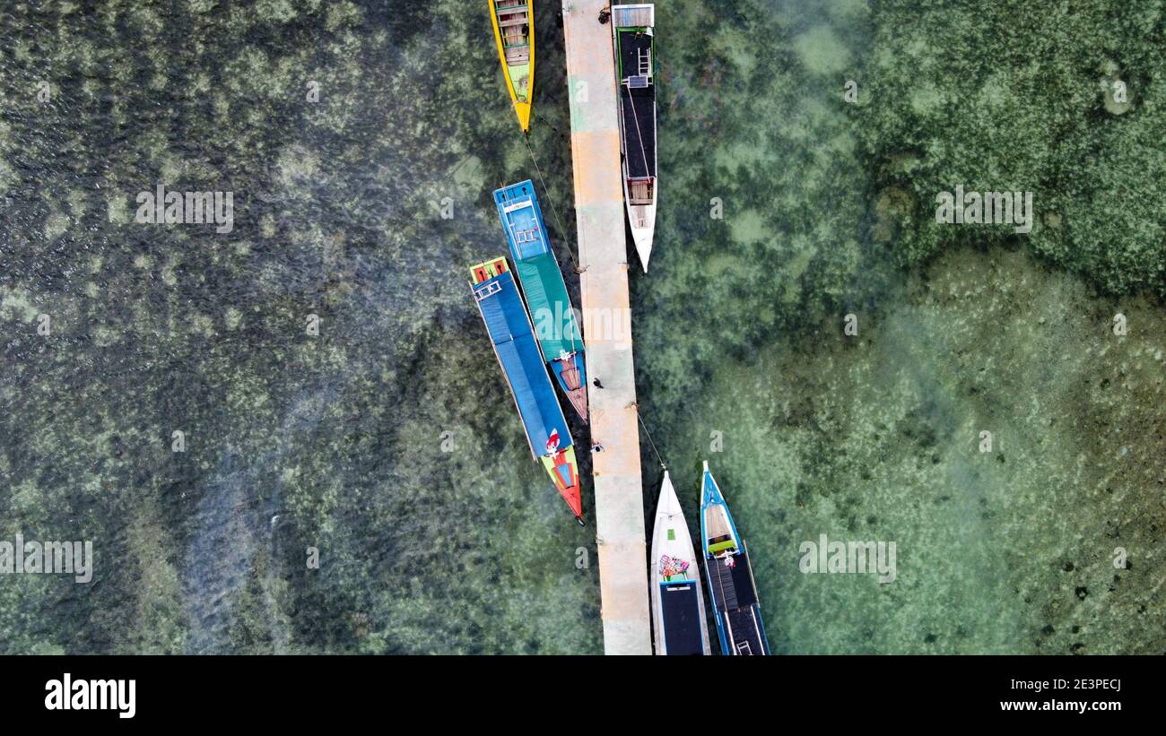 Aerial view of top down picture of colorful wooden boats. Boats at the ...