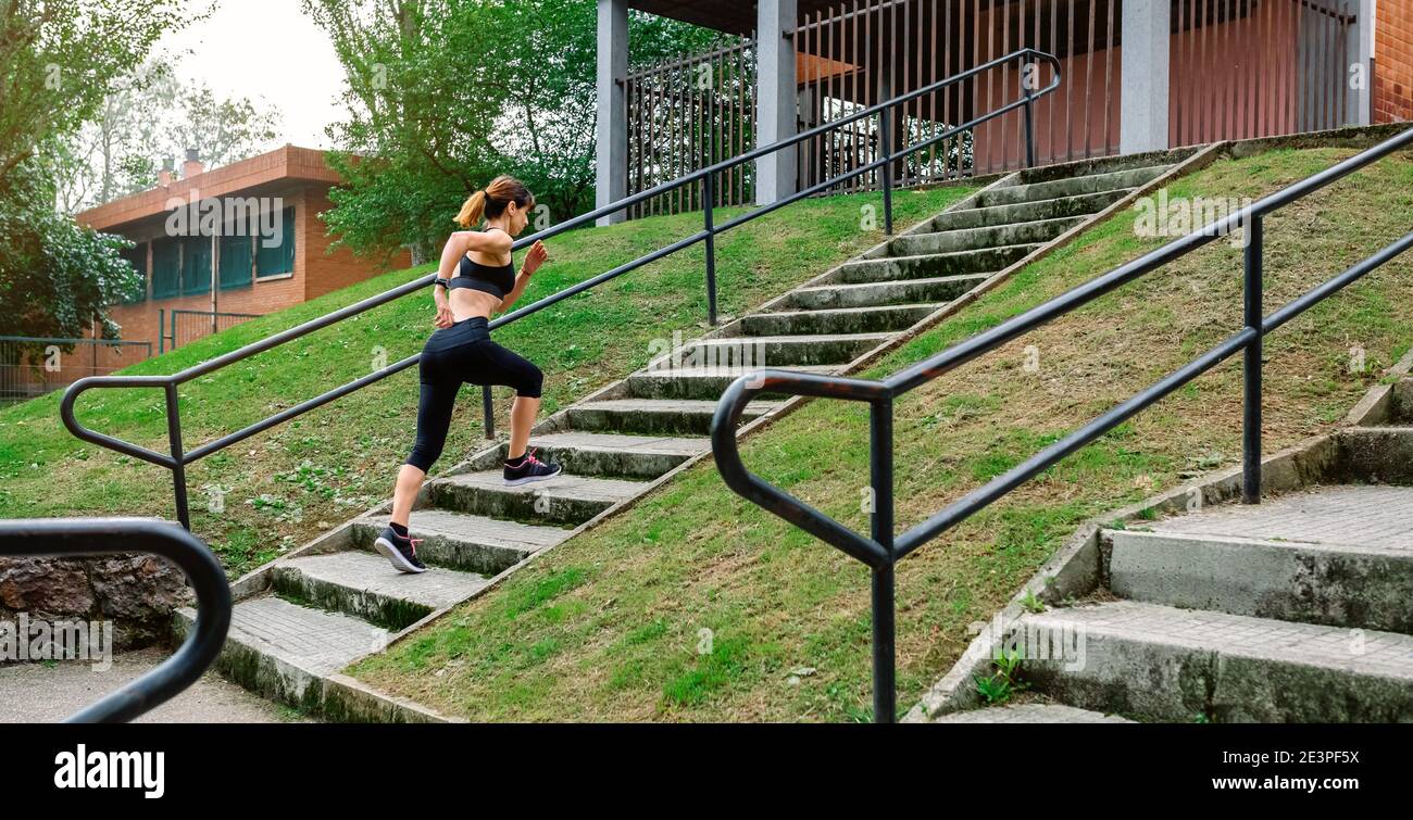 Female athlete climbing stairs outdoors Stock Photo Alamy
