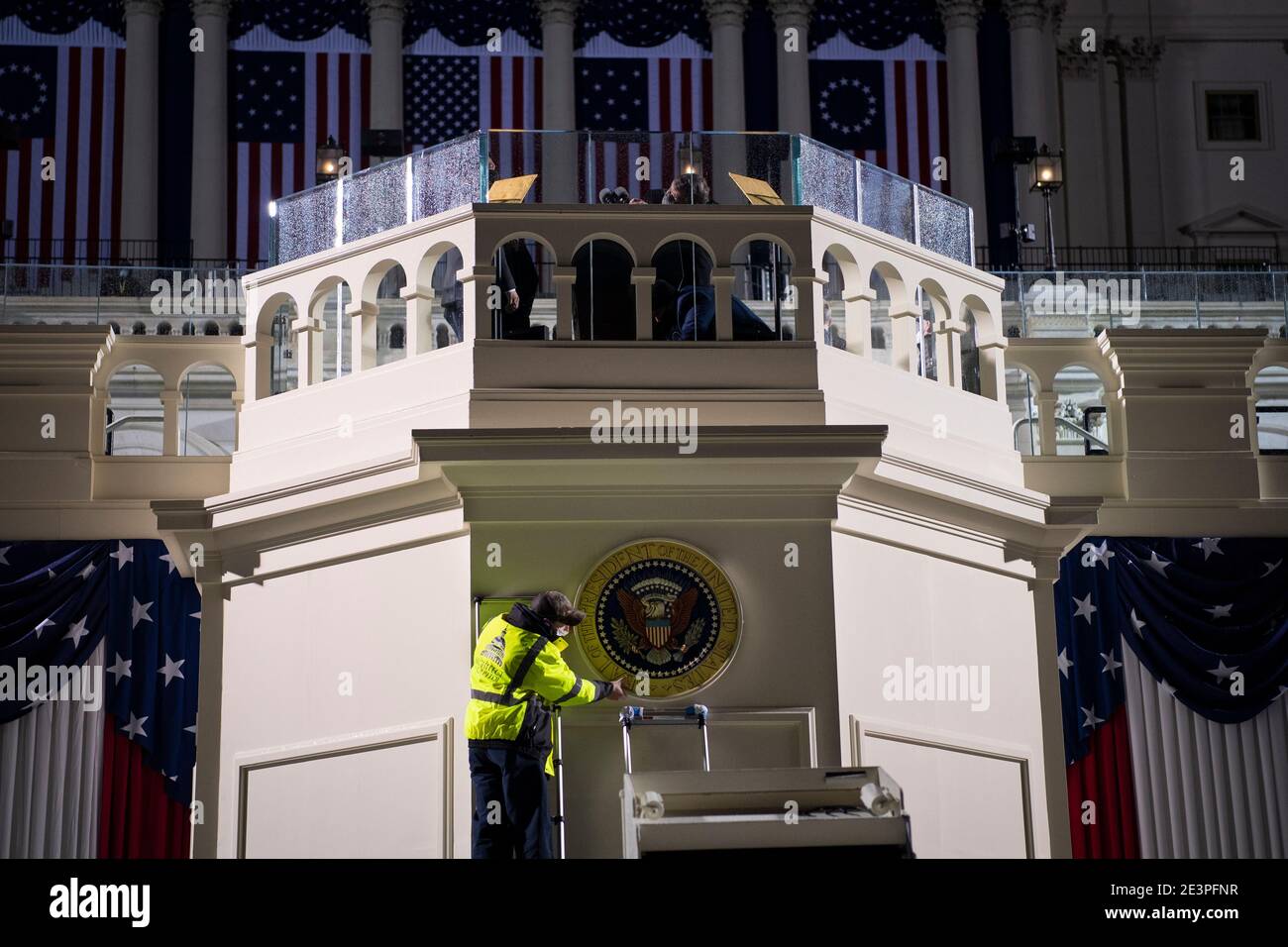 UNITED STATES - January 20: An Architect of the Capitol worker places a Presidential seal on a wall as preparations are made prior to the 59th inaugural ceremony for President-elect Joe Biden and Vice President-elect Kamala Harris on the West Front of the U.S. Capitol in Washington on Wednesday, Jan. 20, 2021. Credit: Caroline Brehman / Pool via CNP | usage worldwide Stock Photo