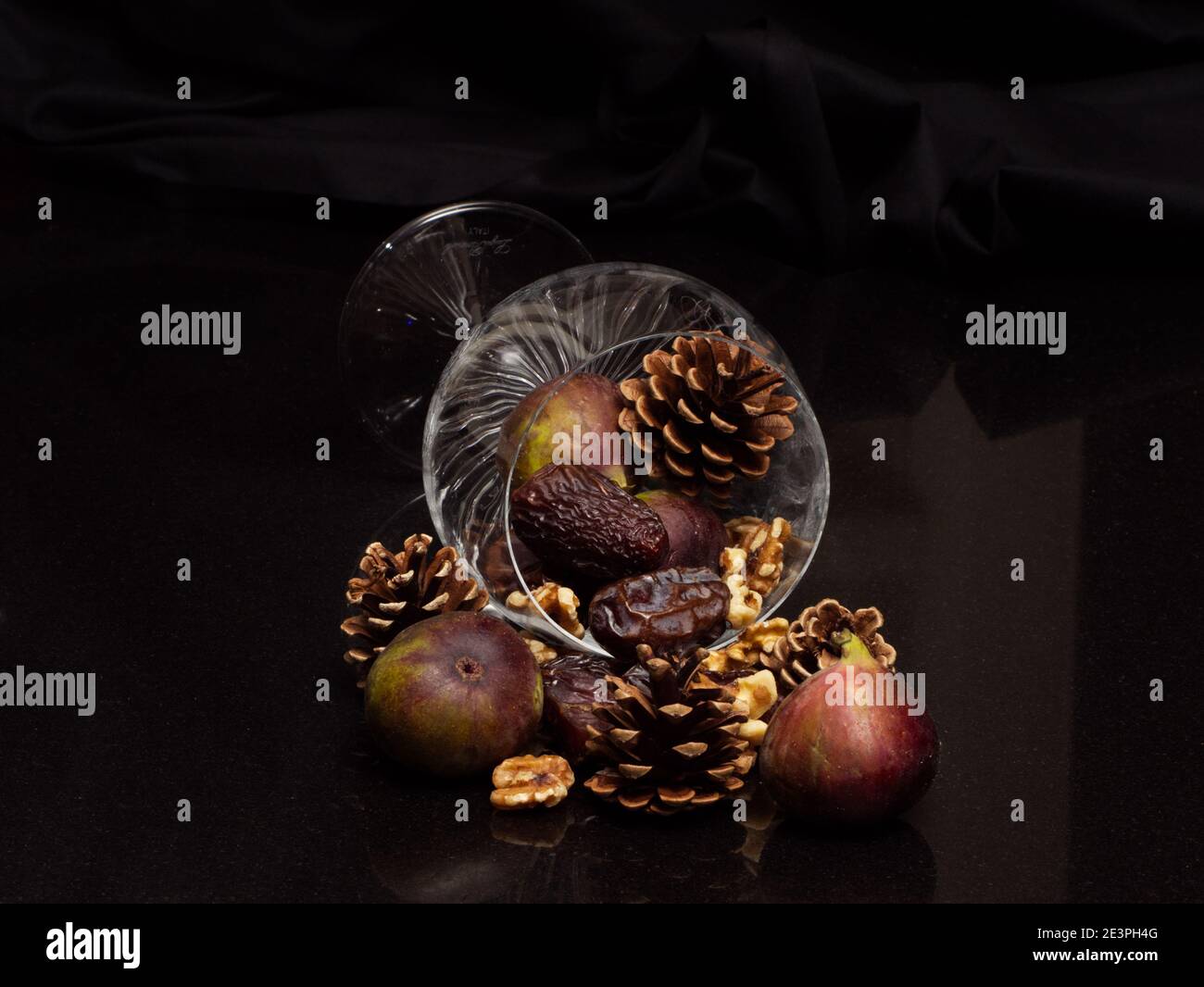 Still Life of fresh fruit, Figs, Dates, Walnuts, Cones in cut crystal