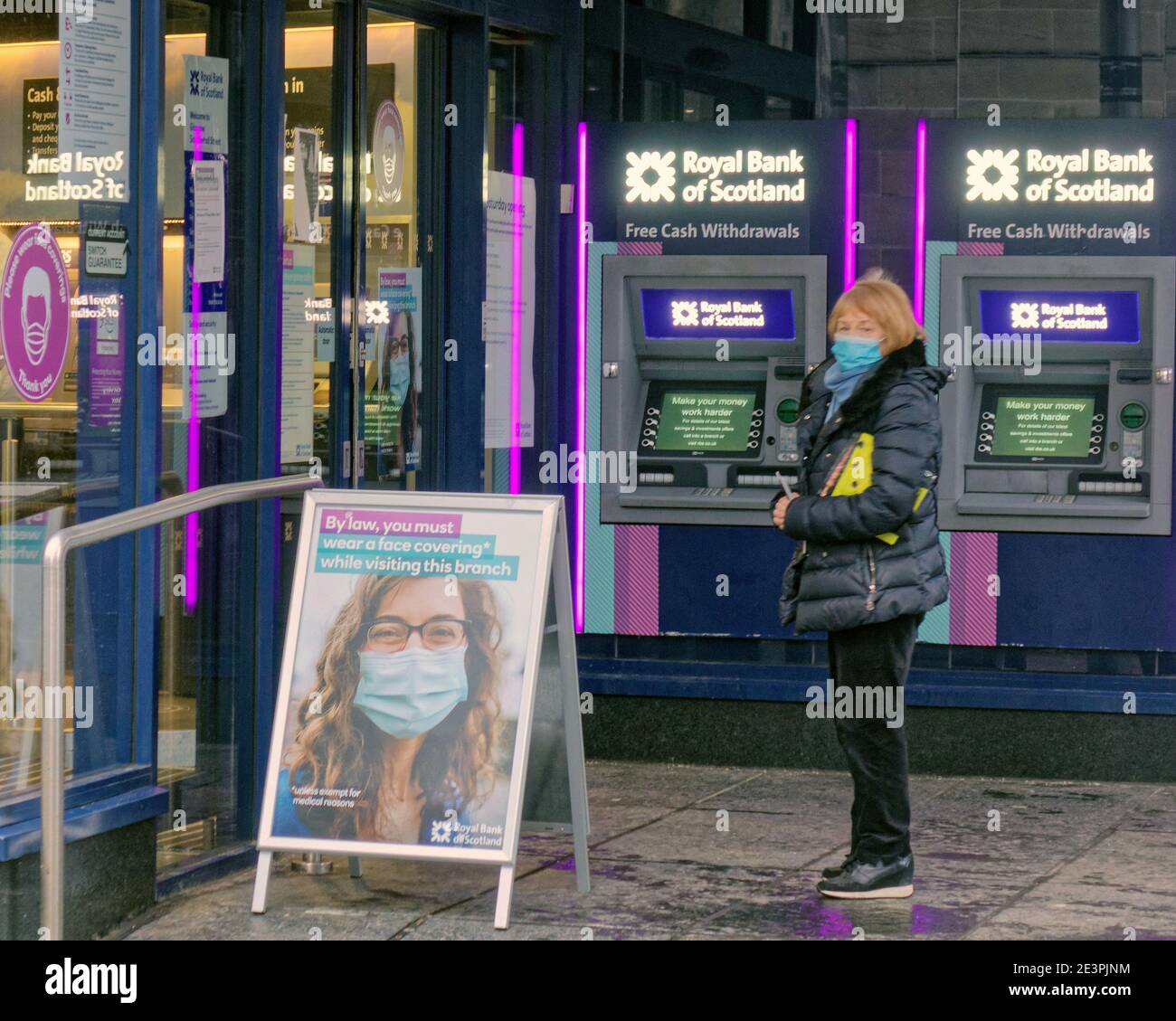 Glasgow, Scotland, UK. 20th January, 2021.Lockdown Wednesday was wet and  saw coffee bought by app  with  people walking around lost with the new take-away rules nothing to do. Royal bank has strict rules as customers wait to be leyt in. Credit Gerard Ferry/Alamy Live News Stock Photo