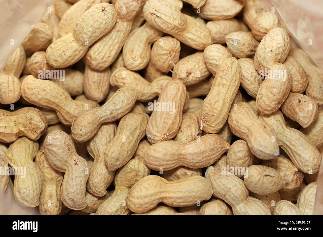 A nylon bag of peanuts in shell Stock Photo Alamy