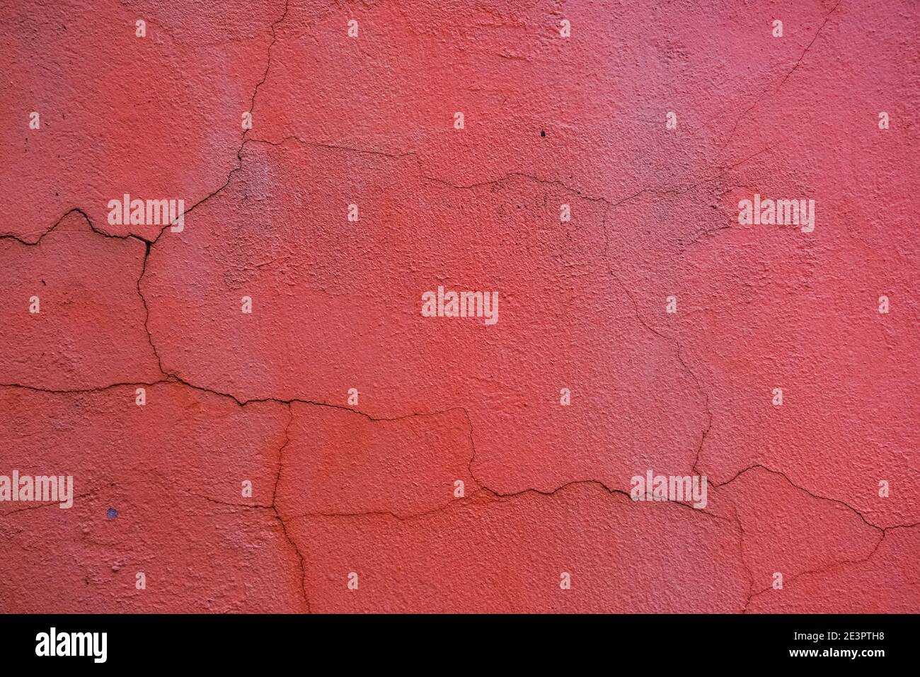 Rough textured red wall with stains, selective focus Stock Photo