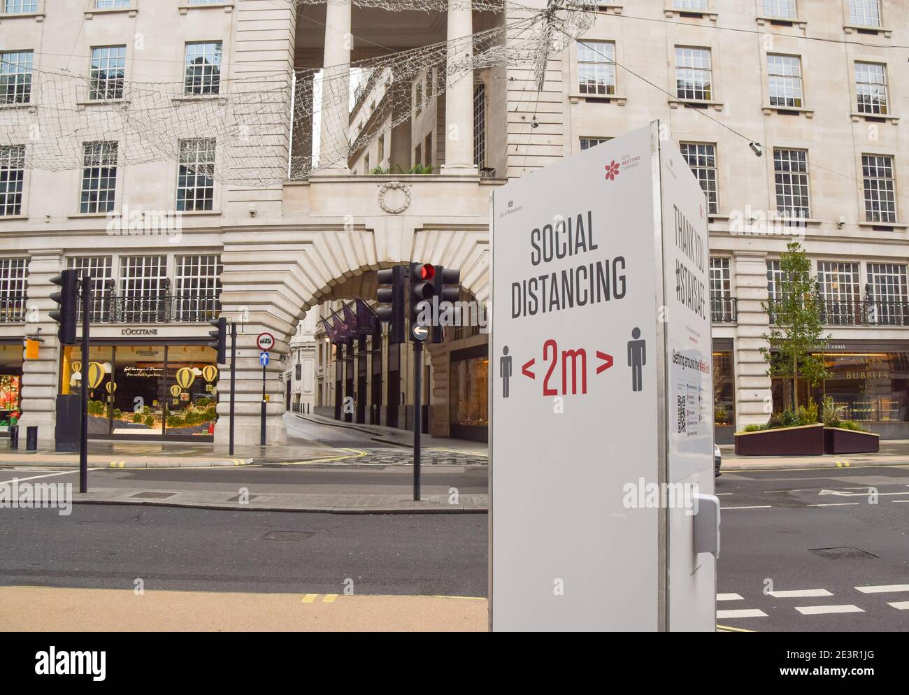 A social distancing sign on an empty Regent Street in London, during the third national coronavirus lockdown in England. Stock Photo