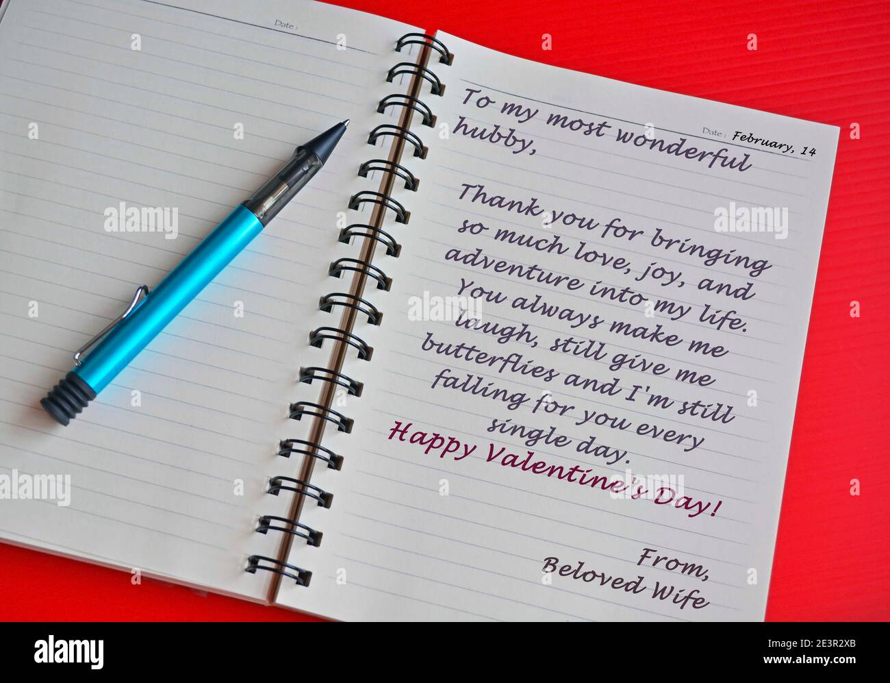 Text on white notepad with red background. Top view and Valentine's day concept Stock Photo