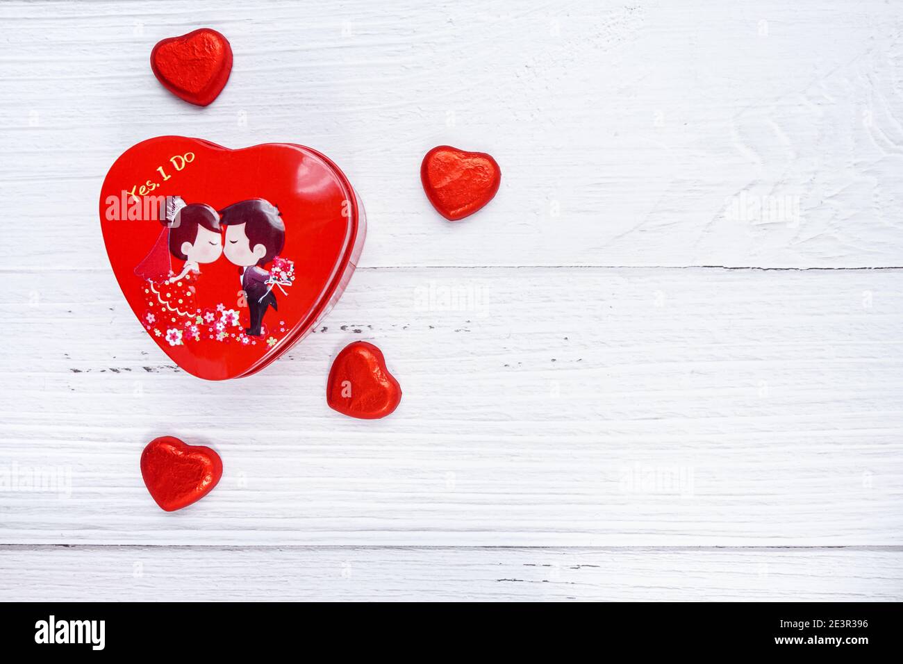 valentine day concept. mini hearts in heart shape box and pine leaves on  top. white wood texture background. anniversary, mother's day and birthday  Stock Photo - Alamy