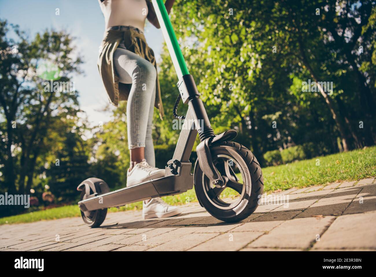 Cropped view of her she teenage teen trendy skinny slim fit hipster girl's  legs riding kick scooter spending free time sunny day having fun activity  Stock Photo - Alamy