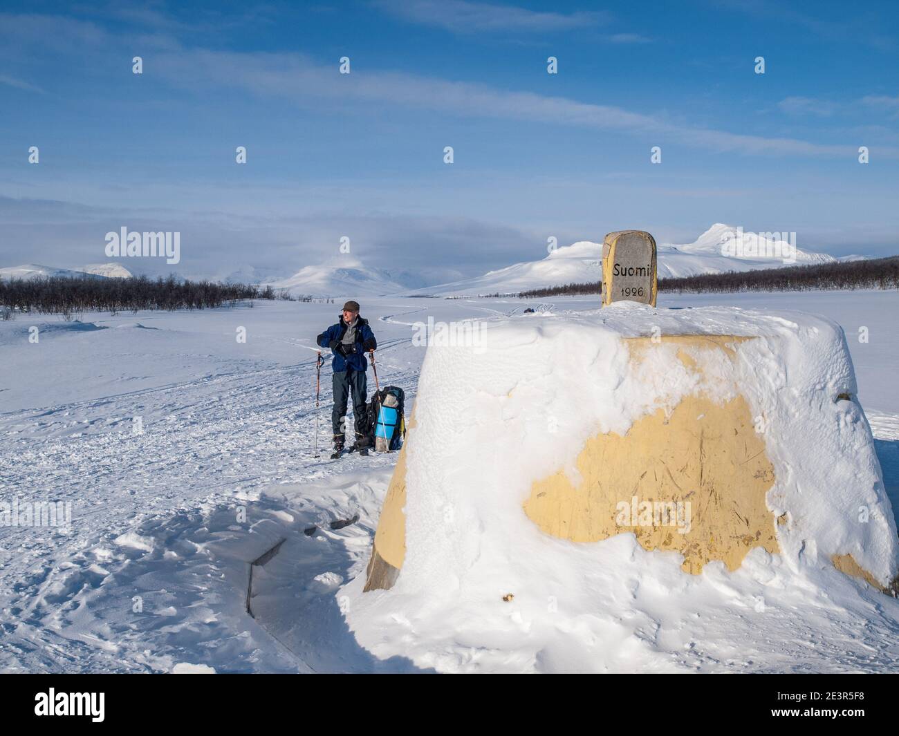 The Three Border Stone / Cairn marking the border between Finland, Norway and Sweden near Kilpisjarvi,  in winter Stock Photo