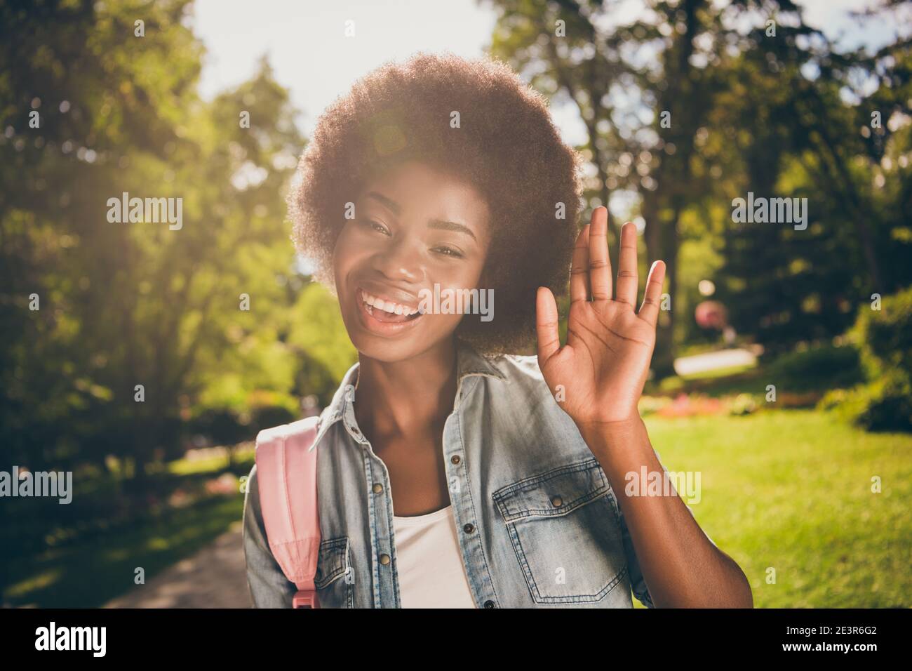 Photo portrait of cheerful african american girl waving hand wearing ...