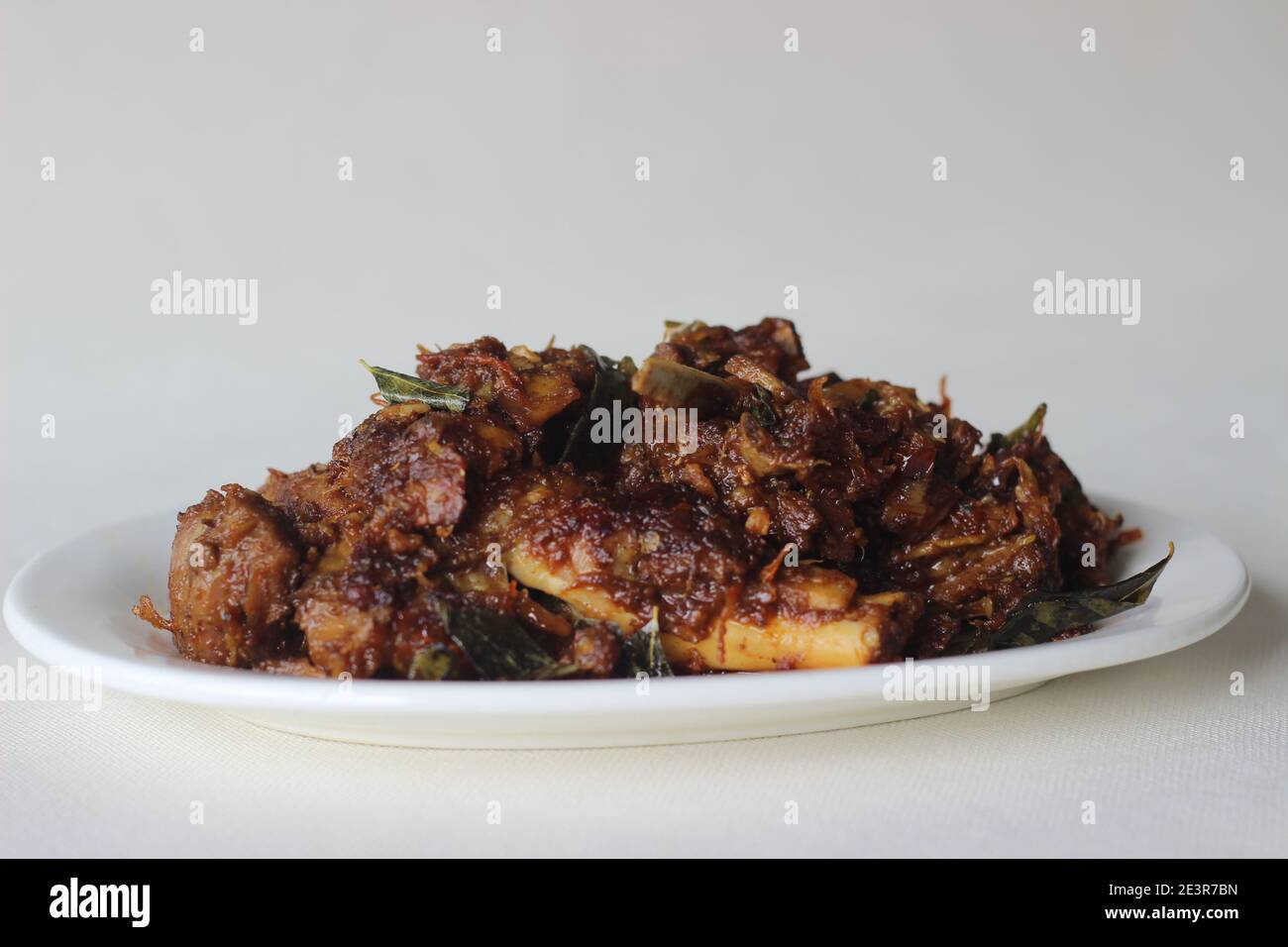 Spicy mutton roast prepared in Kerala style for special occasions like Christmas, Easter, Onam and other festivals Stock Photo