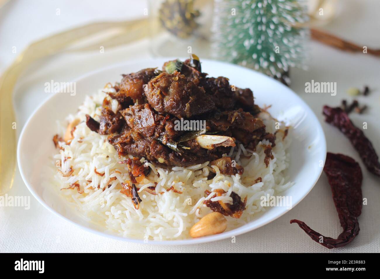 Aromatic traditional Ghee rice and spicy mutton roast prepared in