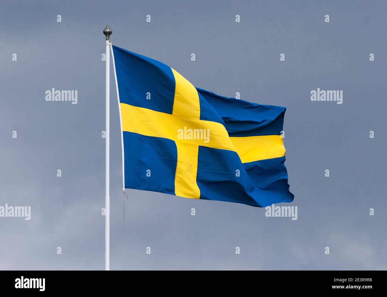 SWEDISH FLAG on pole flutter in wind Stock Photo