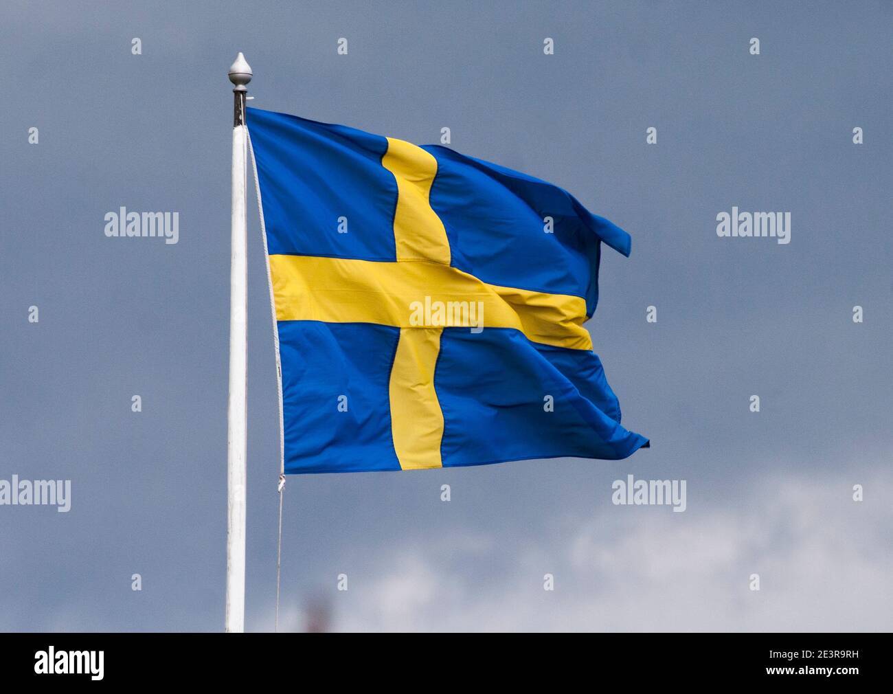 SWEDISH FLAG on pole flutter in wind Stock Photo