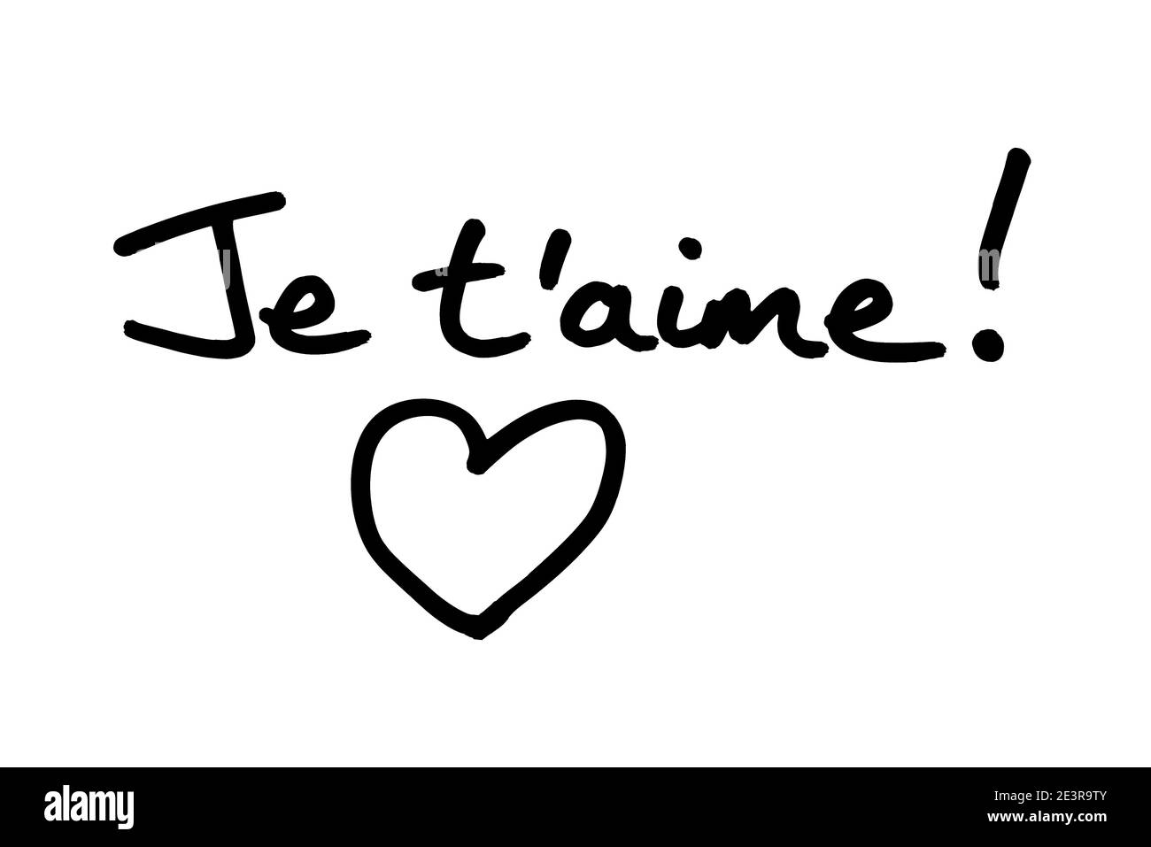 Je taime! - meaning I Love You in the French language, and a heart illustration, handwritten on a white background. Stock Photo