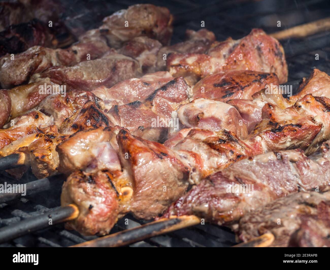 Roasted meat cooked at barbecue Stock Photo Alamy