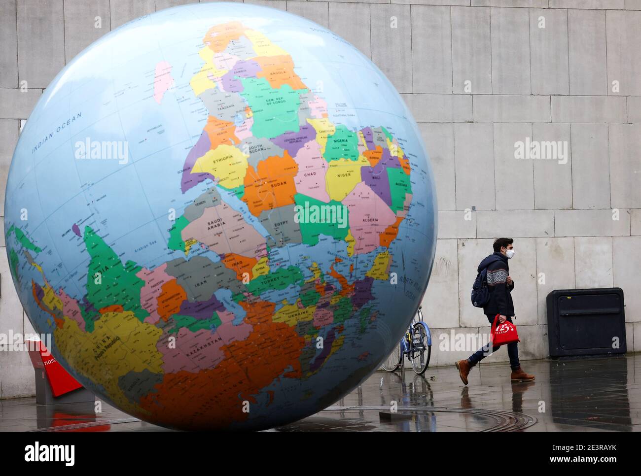 The world turned upside down sculpture hires stock photography and