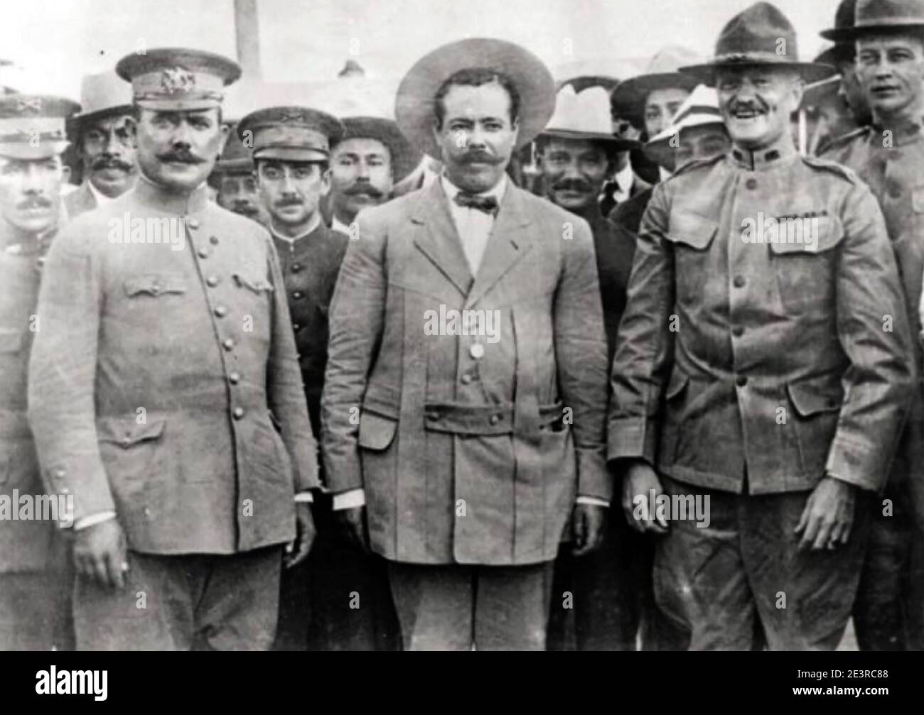 PANCHO VILLA (1878-1923) Mexican revolutionary at centre after a meeting with US General John J. Pershing at right at Fort Bliss, Texas in 1914. Behind Villa's right shoulder is Mexican General Álvaro Obregón who would later loose his right arm fighting Villa's army during the 1914-15 civil war that followed the removal of Victoriano Huerta. At far right is Pershing's aide 1st Lt, George S.Patton. Stock Photo