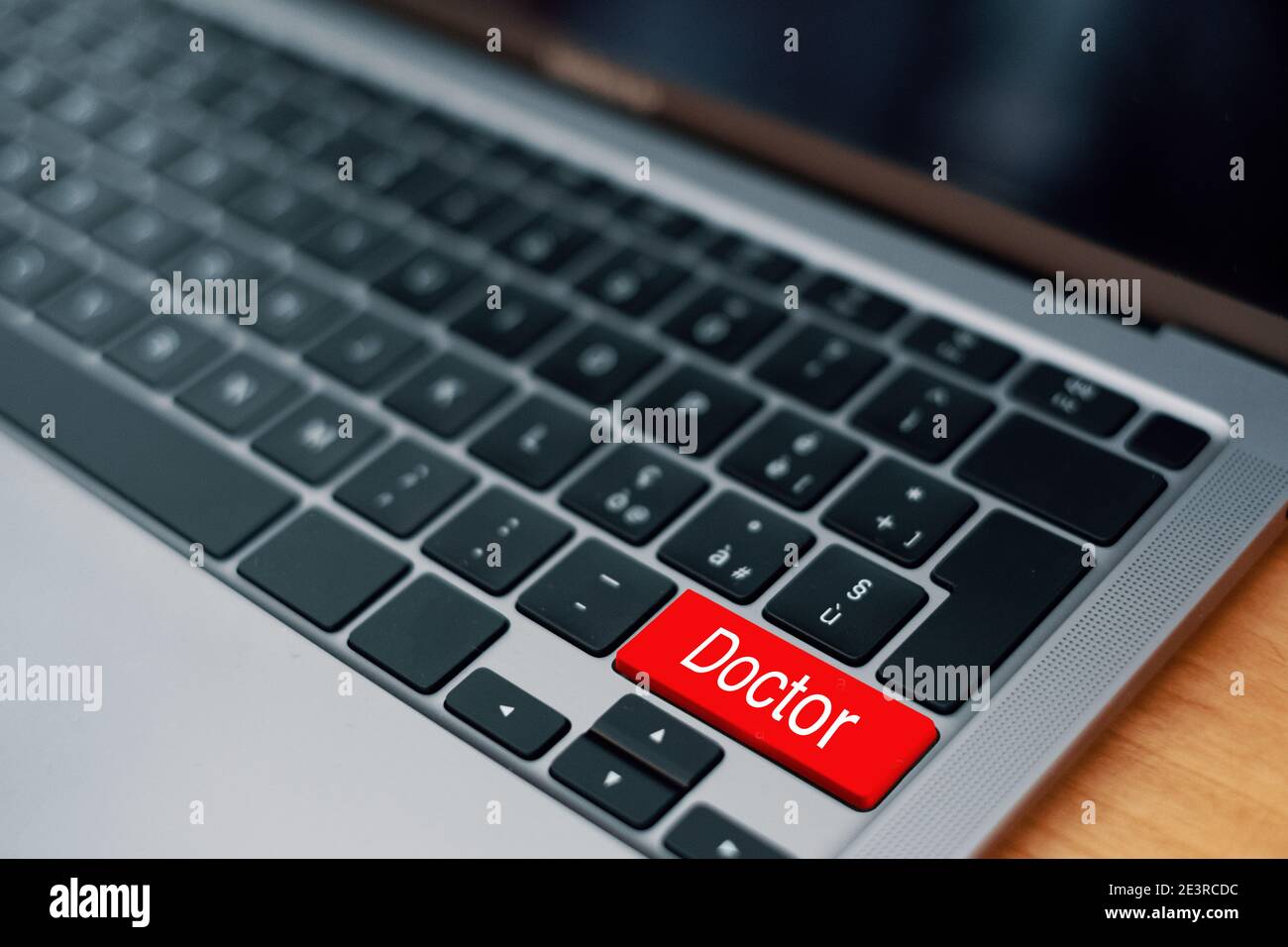 Find a doctor online with the internet on a computer keyboard Stock Photo