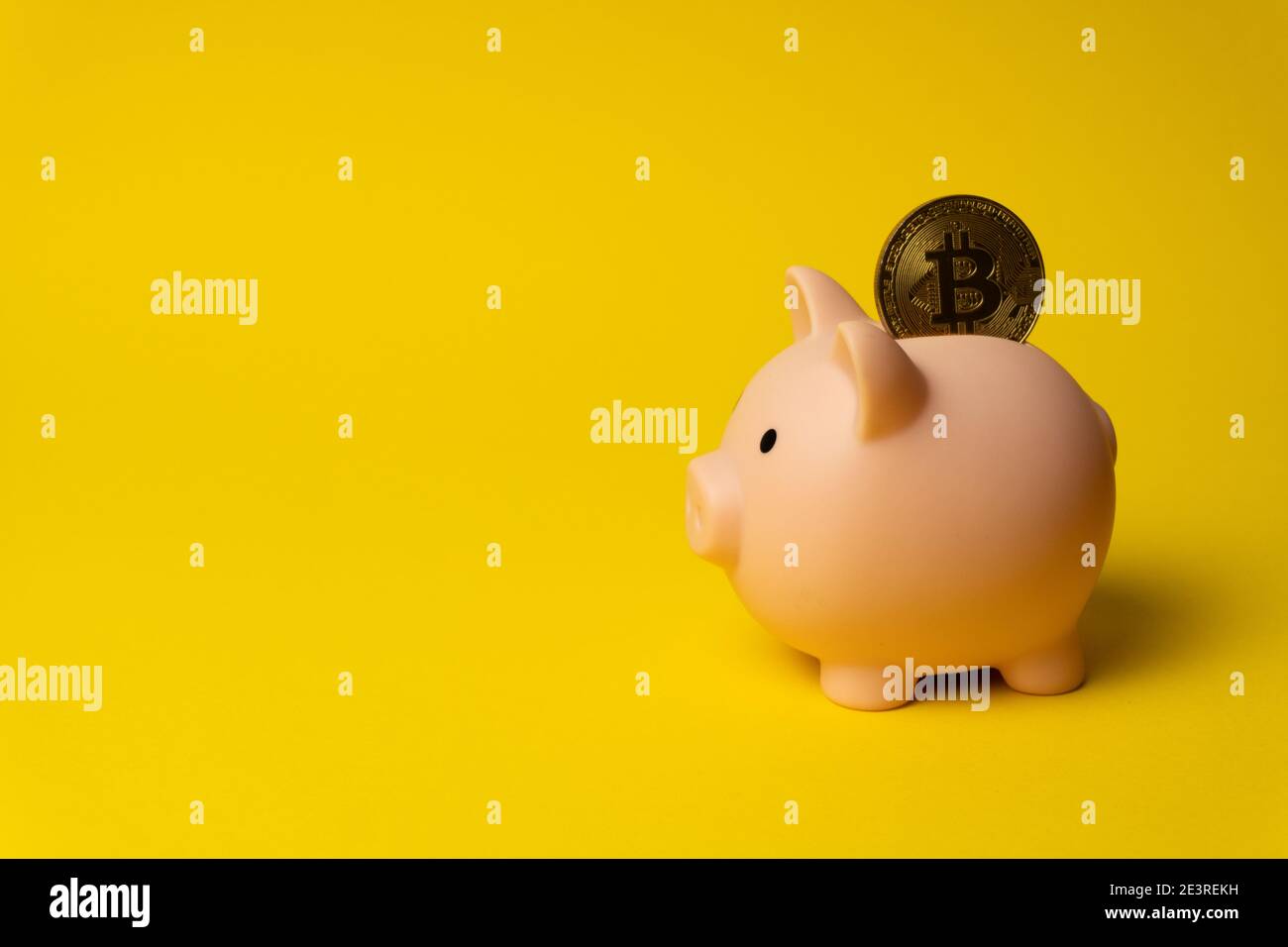 Pink piggy money box with coin of Bitcoin Stock Photo