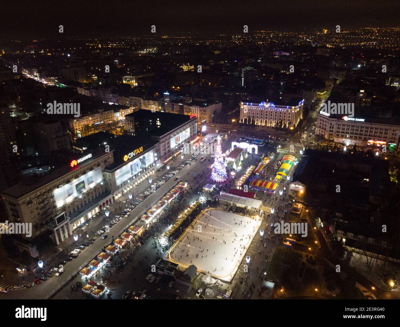 Freedom Svobody Square (Kharkiv) aerial view at night with New year holidays and Christmas tree decorations with colorful illumination in city center Stock Photo