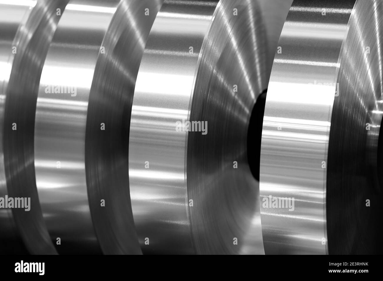 final coils of aluminum foil after sliting on the axis machine, black and white photo Stock Photo