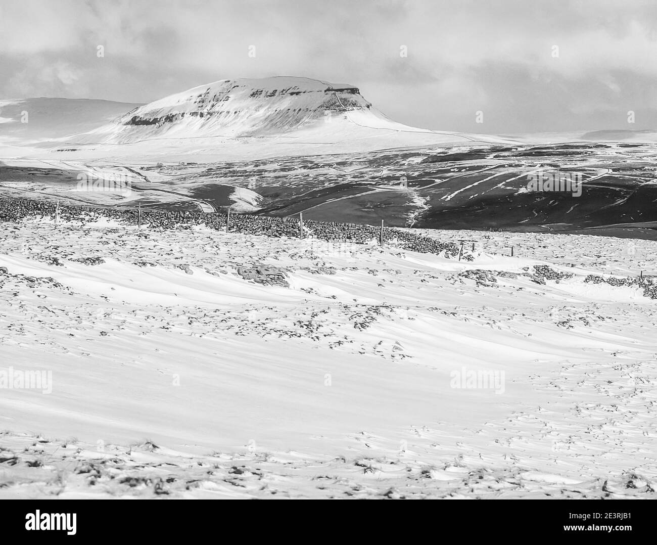 England.Fabulous winter scenery in monochrome of Penyghent one of the famous Yorkshire Dales Three Peaks Stock Photo