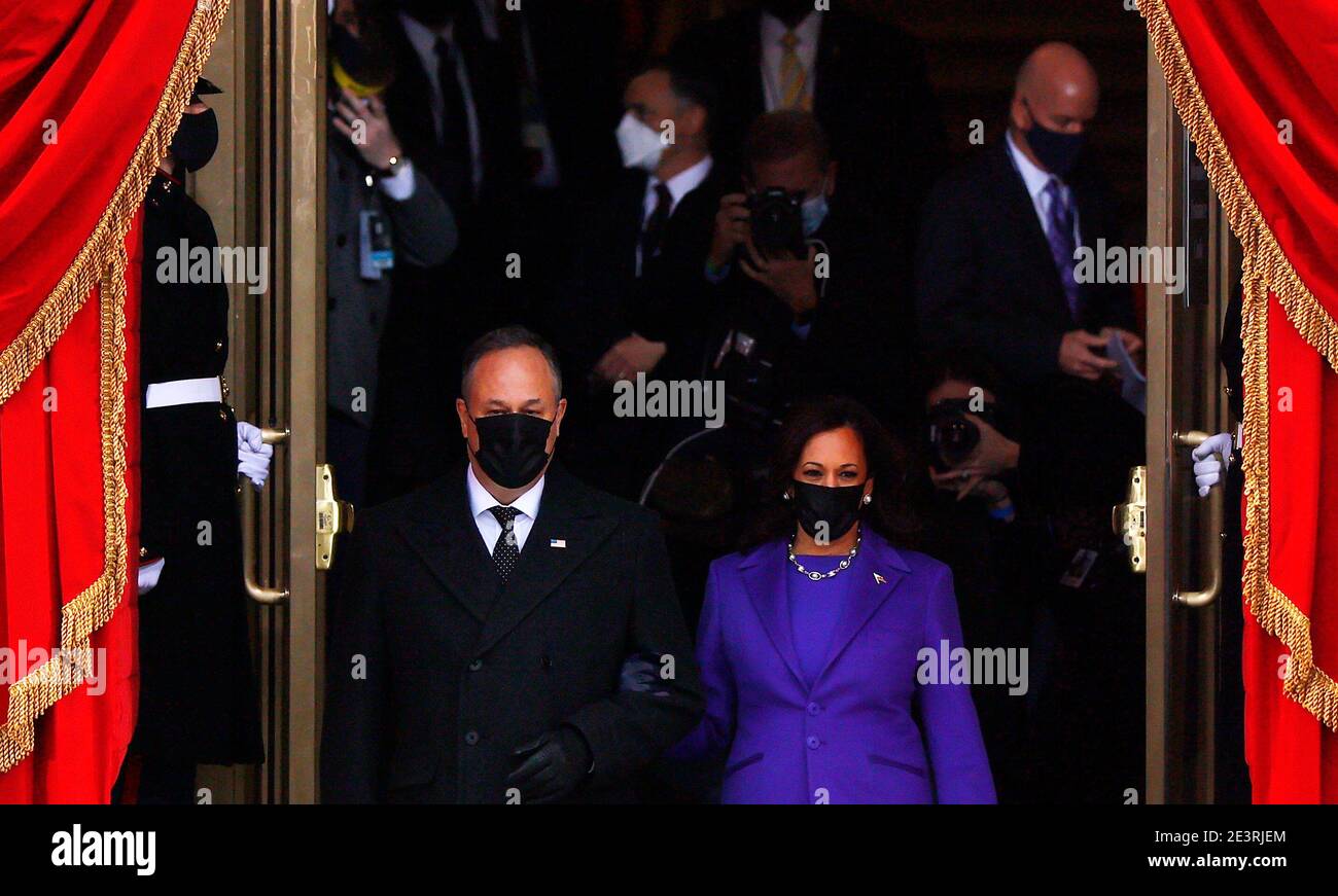 Vice President-elect Kamala Harris and her husband Doug Emhoff arrive on platform during the inauguration of Joe Biden as the 46th President of the United States on the West Front of the U.S. Capitol in Washington, U.S., January 20, 2021. REUTERS/Jim Bourg Stock Photo
