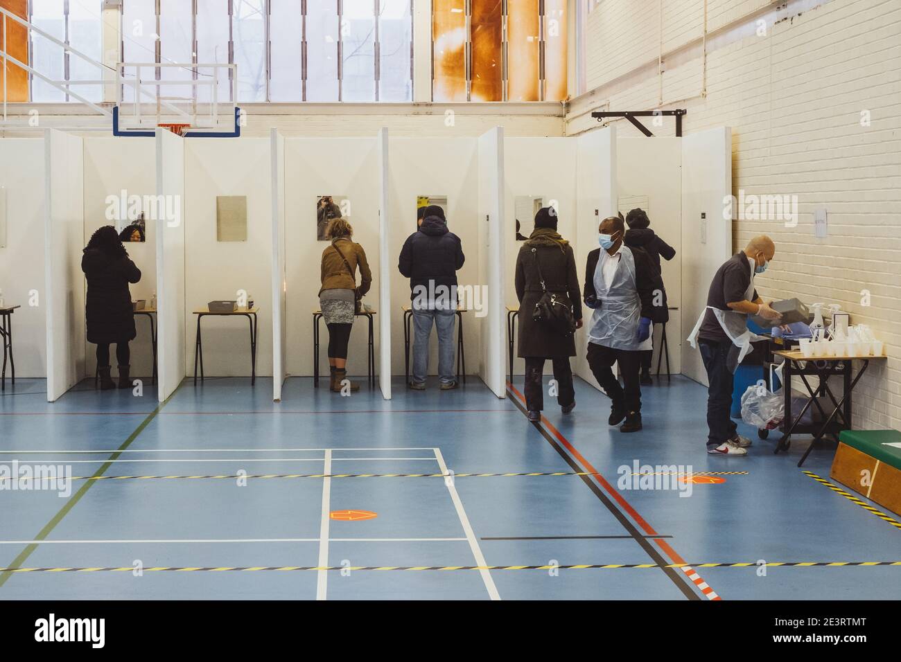 Camberwell, London, UK. 20th Jan, 2021. People line up in cubicles to ...