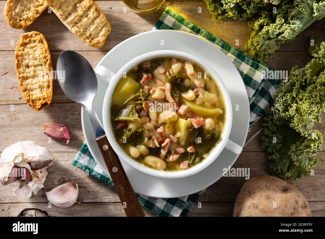 Creamy Tuscan soup on wooden table Stock Photo