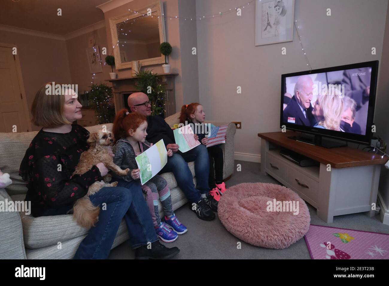 Susan McDonagh and her partner Peter Durcan with their children Maia, 8, and Harlow, 7, and their dog Cookie, watching the inauguration of Joe Biden as the 46th President of the United States. President elect Biden has ancestral links to the area on the West coast of Ireland as well as on the Cooley Peninsula in Co. Louth, on the East coast. Stock Photo